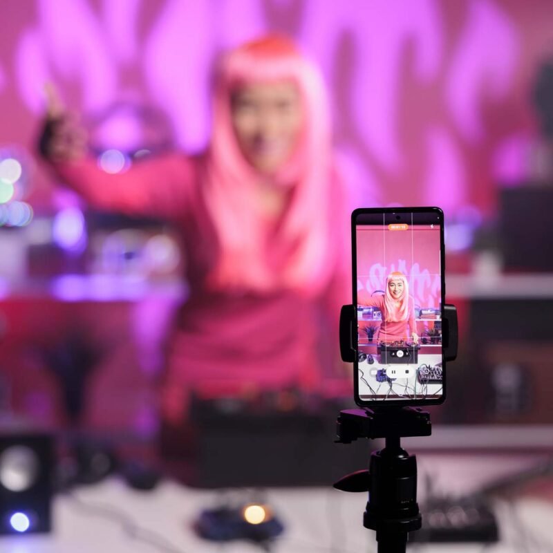 Social media influencer filming video content on a smartphone for Instagram or TikTok